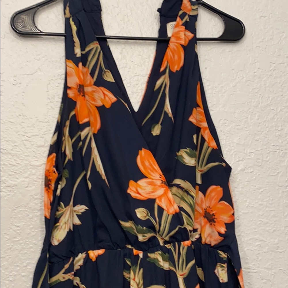 Sleeveless romper. Shorts with pants.